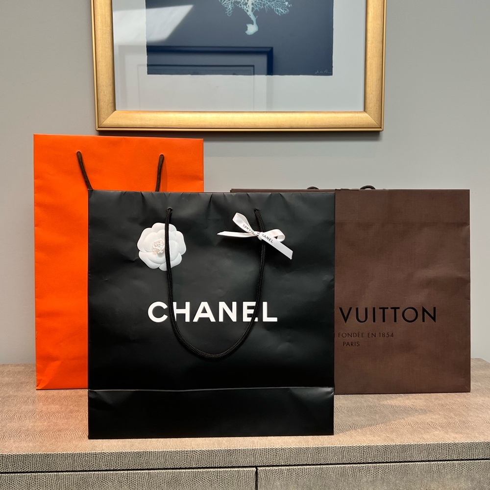 Authentic CHANEL shopping bag with ribbon and flower